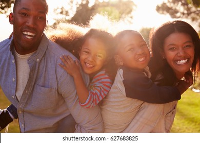 Portrait Of Happy Family In Summer Garden - Shutterstock ID 627683825