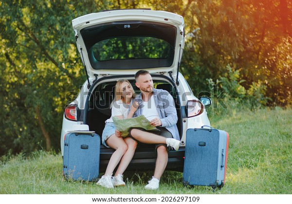 Portrait of\
happy family. Vacation, Travel - family ready for the travel for\
summer vacation. suitcases and car\
route.