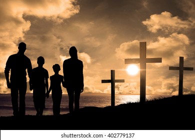 Portrait of happy family walking over white background against cross religion symbol shape over sunset sky