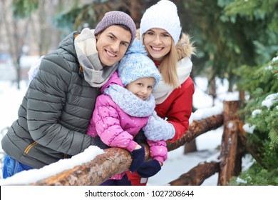 Portrait Of Happy Family In Winter Park