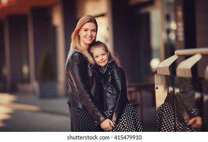 Portrait Of A Happy Family: A Young Beautiful Woman With Her Little Cute Daughter.