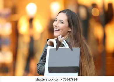 Portrait Of A Happy Fashion Shopper Looking At Camera In A Store