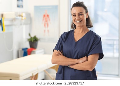 Portrait of happy female caucasian physiotherapist wearing scrubs at hospital. Hospital, physiotherapy, work, medicine and healthcare, unaltered. - Powered by Shutterstock