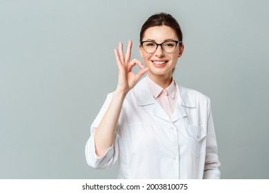 Portrait Of A Happy Female Doctor Showing The OK Sign