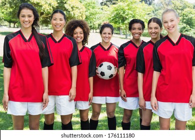 Portrait Of Happy Female Soccer Team At Park