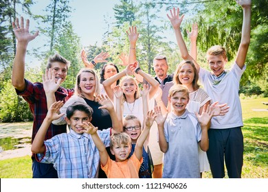 Portrait of happy foster family laughing in park