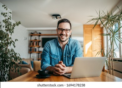 Portrait of a happy freelancer at home office. - Shutterstock ID 1694178238