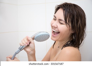 Portrait Of Happy Funny Woman Singing In Shower