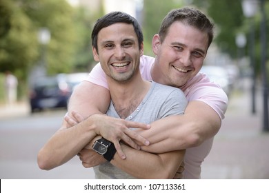 Portrait Of A Happy Gay Couple Outdoors