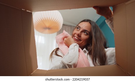 Portrait Of Happy Girl Unpacking Delivery Parcel Sitting At Home. Smiling Satisfied Young Woman Shopper, Online Shop Customer Opening Cardboard Box Receiving Purchase Gift By Fast Postal Shipping