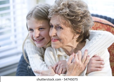 Portrait Of Happy Grandmother With Grandchild Hugging