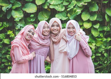 portrait of happy group of pretty girl best friends together. muslim woman concept wearing hijab or head scarf