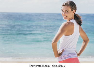 Portrait Of Happy Healthy Woman Doing Warm Up At The Beach With Copy Space