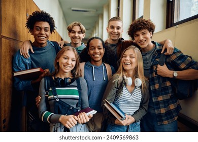 Portrait of happy high school students in hallway looking at camera. - Powered by Shutterstock