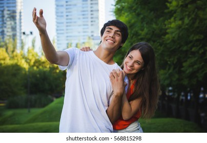 Portrait Of Happy Hispanic Couple In The Park