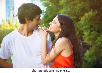 Portrait Of Happy Hispanic Couple In The Park