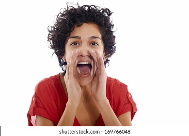 Portrait of happy hispanic woman screaming and shouting at camera