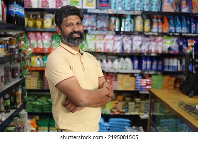 Portrait of happy Indian man standing in front of the product counter in a grocery store. Man buying grocery for home in supermarket.  - Shutterstock ID 2195081505