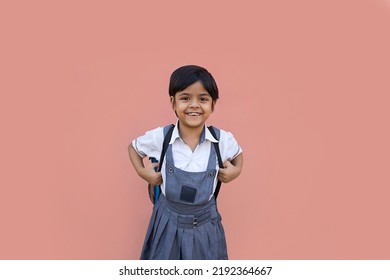 Portrait Of Happy Indian School Girl With Backpack