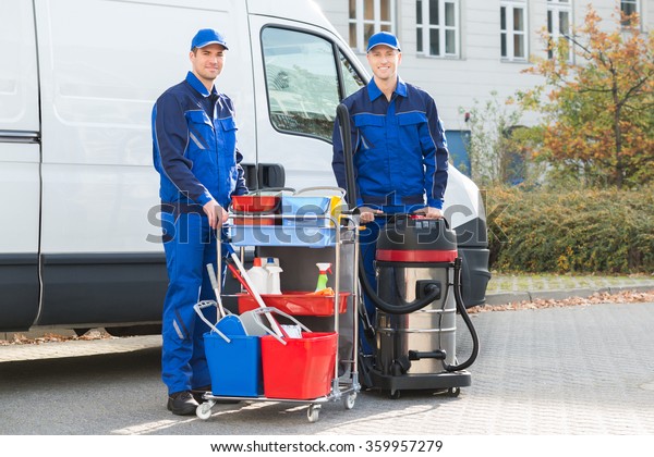 Portrait Happy Janitors Cleaning Equipment Standing Stock Photo (Edit ...