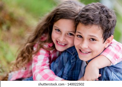 Portrait of happy kids having fun at the park - Powered by Shutterstock