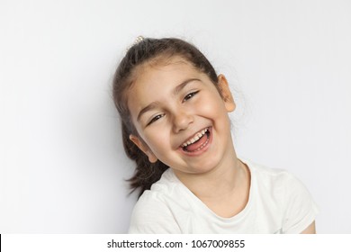 Portrait Of A Happy Laughing Child Girl