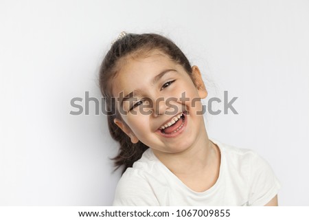 Portrait of a happy laughing child girl