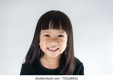 Portrait Of Happy Little Asian Girl Smiling, Asian Child Isolated On White Background.