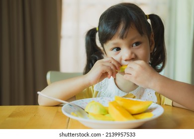 Portrait Happy Little Girl Eating Mango Stock Photo 2139957533 ...