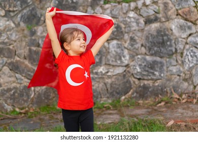 Portrait Of Happy Little Kid. Cute Baby With Turkish Flag T-shirt. Toddler Hold Turkish Flag In Hand. Patriotic Holiday. Adorable Child Celebrates National Holidays. Copy Space For Text.