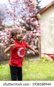 Portrait Of Happy Little Kid. Cute Baby With Turkish Flag T-shirt. Toddler Hold Turkish Flag In Hand. Patriotic Holiday. Adorable Child Celebrates National Holidays. Copy Space For Text.