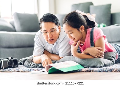 Portrait happy love asian family father teach little daughter asian girl learn   study table Dad   asian young girl writing and book   pencil making lessons in homeschool at home Education