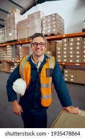 Portrait of a happy male engineer with safety hardhat and in black eyeglasses