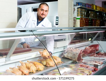 Portrait Of Happy Male Seller In Halal Section At Supermarket