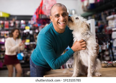 Portrait Of Happy Man With Beloved Dog In Pet Shop