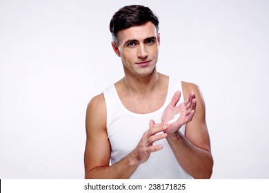 Portrait Of A Happy Man With Cream On The Hand