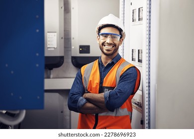 Portrait, happy man and engineering technician in control room, inspection service or industry maintenance. Electrician, arms crossed and smile in electrical substation, system or industrial mechanic