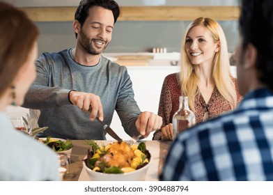 Portrait Of A Happy Man Taking His Share Of Food. Happy Family Reunion At House. Young Friend Meeting For Lunch At Home. Friends Having Dinner Or Lunch At Home.