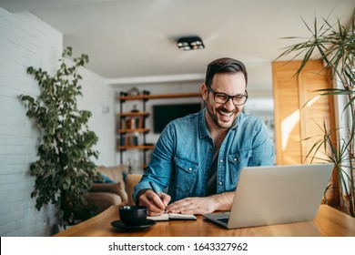 Portrait of a happy man taking notes. - Shutterstock ID 1643327962