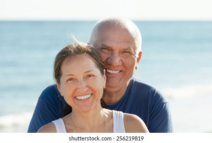 Portrait of Happy mature couple against sea and sky background