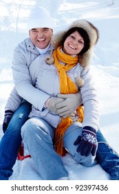 Portrait Of Happy Mature Couple Having Fun In Winter