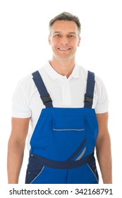 Portrait Of Happy Mature Male Janitor Standing Against White Background