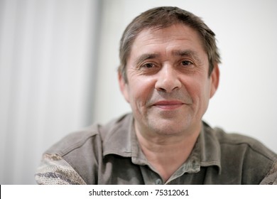 Portrait Of Happy Mature Man Looking At Camera. Closeup, Shallow DOF.