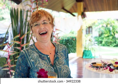 Portrait Of A Happy Mature Woman At A Party.