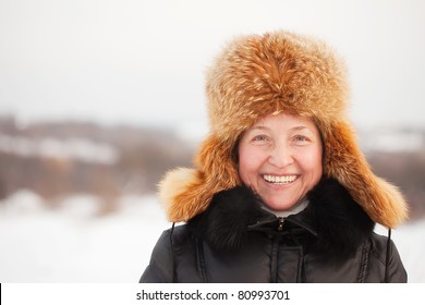 Portrait Of Happy Mature Woman In Winter Park