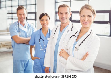 Portrait Of Happy Medical Team Standing Together In Hospital