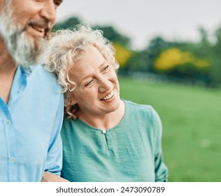 Portrait of a happy middle aged woman and  active middle aged white couple having fun walking holding hands and bonding in park outdoors - Powered by Shutterstock