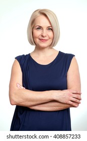 Portrait Of Happy Middle Aged Woman Over White Background. Friendly Business Woman