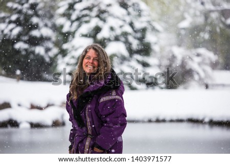 A portrait of a happy middle aged woman in a wintery Colorado, USA