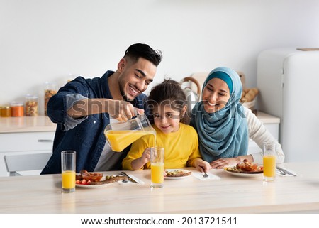 Similar – Image, Stock Photo Three men in orange